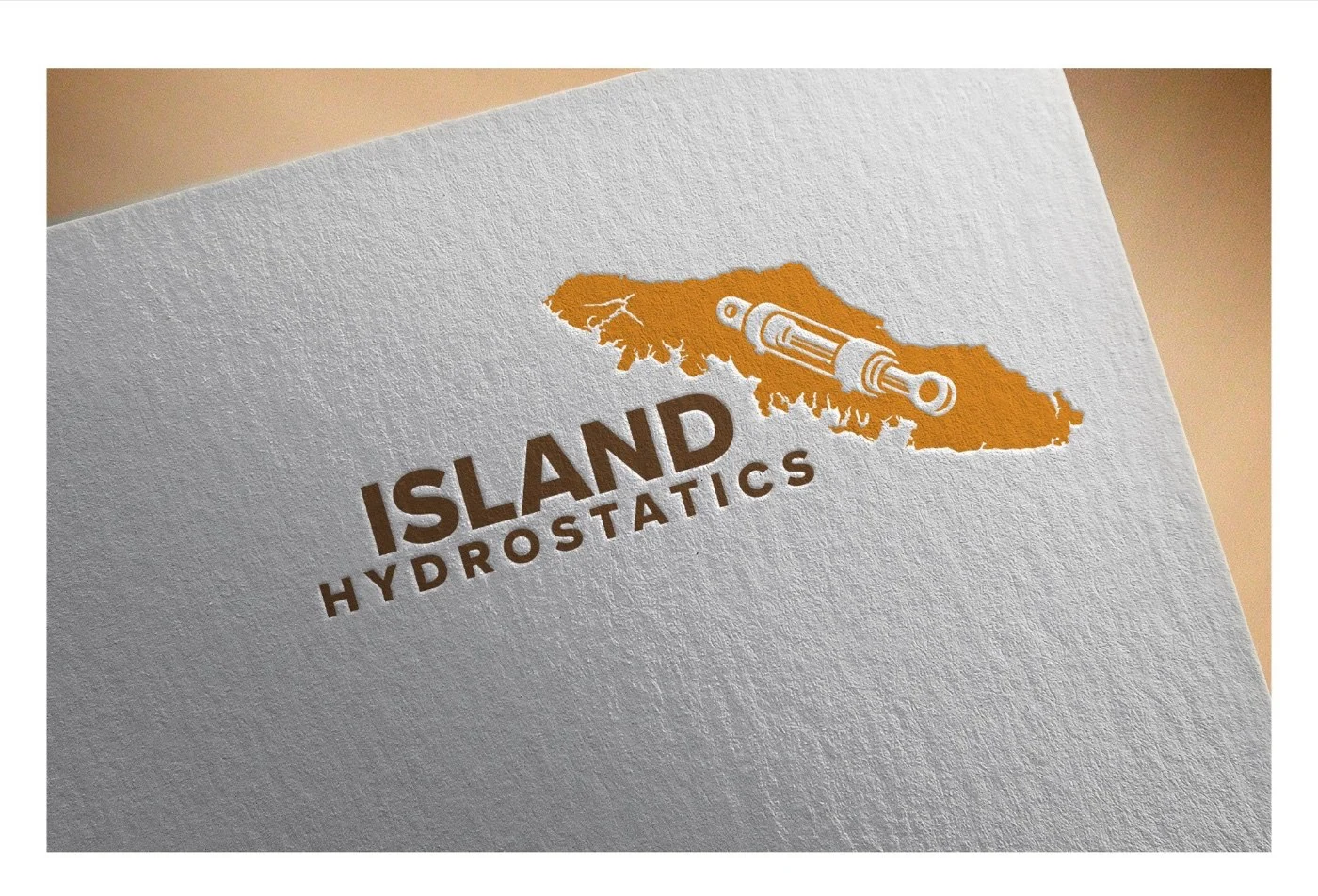 The Island concept applied to a letterpress mockup on textured grey paper: a Vancouver Island silhouette in saturated orange with a detailed hydraulic cylinder integrated into the centre of the island shape, ISLAND HYDROSTATICS in cocoa-brown sans serif beneath