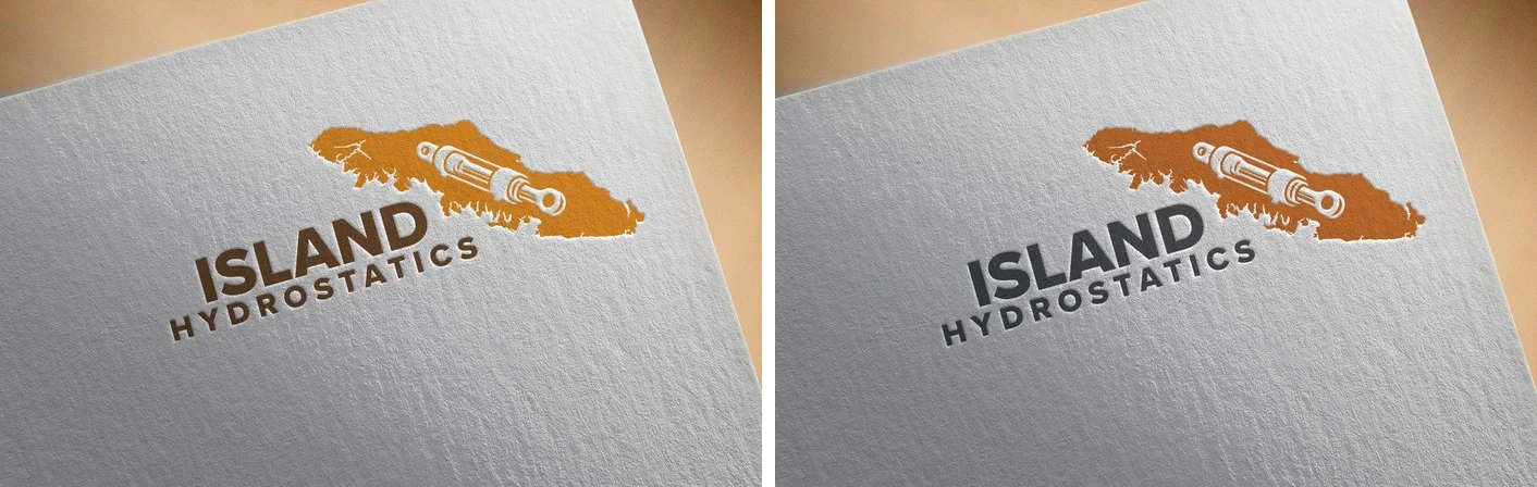 A side-by-side comparison of two letterpress mockups of the Island Hydrostatics mark: the v1 version on the left with a less-detailed island silhouette and softer cylinder rendering in cocoa wordmark, and the final v3 version on the right with a more detailed coastline including small offshore islands at the top, sharper cylinder detail with crisper port and rod definition, and the wordmark in graphite grey