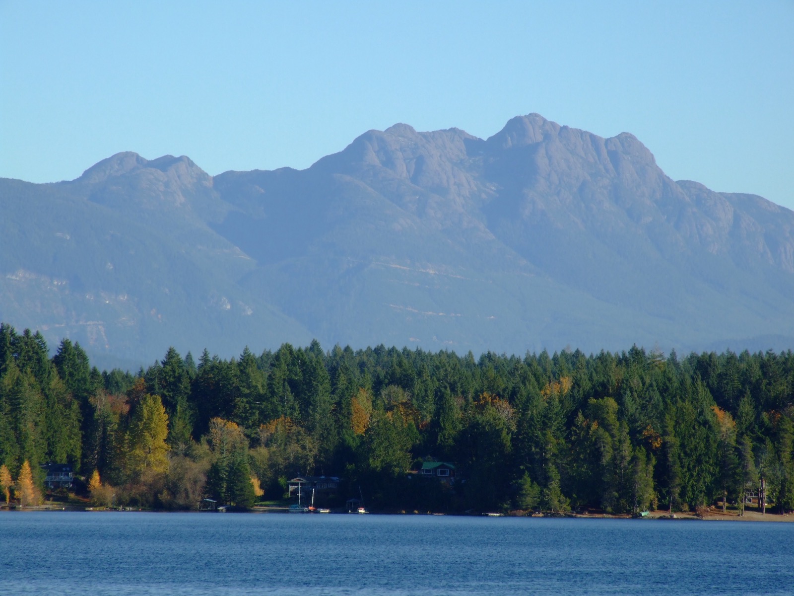 Mount Arrowsmith seen from across Sproat Lake on Vancouver Island, its triangular ridge rising above the treeline