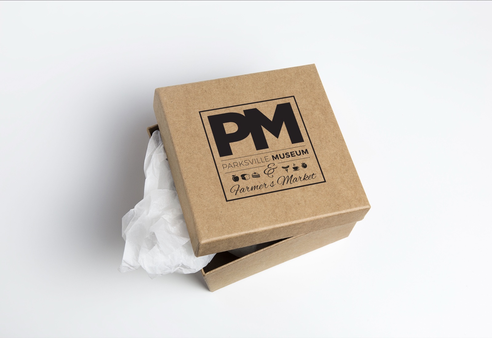 A kraft gift box showing the Parksville Museum and Farmer's Market combined logo lockup