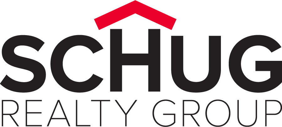 The Schug Realty Group logo: SCHUG in heavy black geometric sans, with the H taller than its neighbouring letters, its central crossbar removed, and a red chevron sitting above it forming the roof of a house. REALTY GROUP runs beneath in a thin letterspaced sans